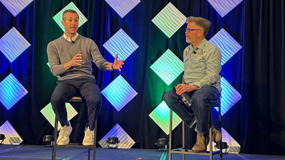 Alterra CEO Jared Smith (left) speaks with Colorado Sun reporter Jason Blevins at the Mountain Travel Symposium.