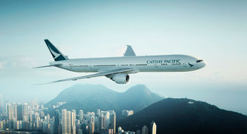 A Cathay Pacific Boeing 777-300ER plane over Hong Kong.