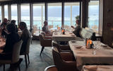 Floor-to-ceiling windows bring the outside inside in La Terrazza, the ship's main dining room.