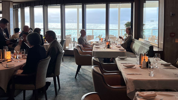 Floor-to-ceiling windows bring the outside inside in La Terrazza, the ship's main dining room.