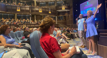 Royal Caribbean International CEO Michael Bayley and senior vice president of sales Vicki Freed address travel advisors on the new Utopia of the Seas.