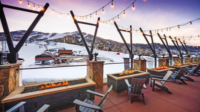 An outdoor lounge overlooking the slopes at the Sheraton Steamboat Resort Villas.