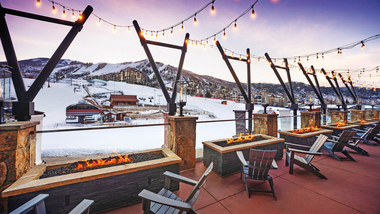 An outdoor lounge overlooking the slopes at the Sheraton Steamboat Resort Villas.