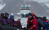 Taking a Zodiac excursion in the Svalbard archipelago, with Aurora Expeditions' Sylvia Earle in the background.