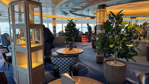 The Commodore Club on the Queen Anne is a spacious forward lounge and a Cunard staple.