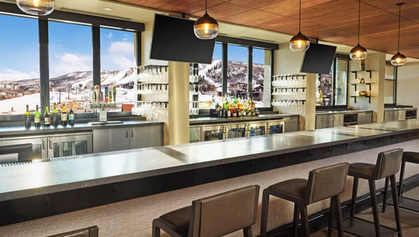 The hotel's Saddles Lounge is located on the lobby level facing the slopes.