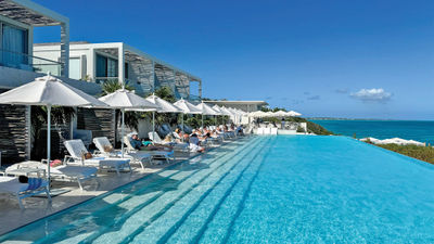 The 100-foot infinity pool at the Rock House, a luxury Turks and Caicos resort perched on an oceanfront cliff.